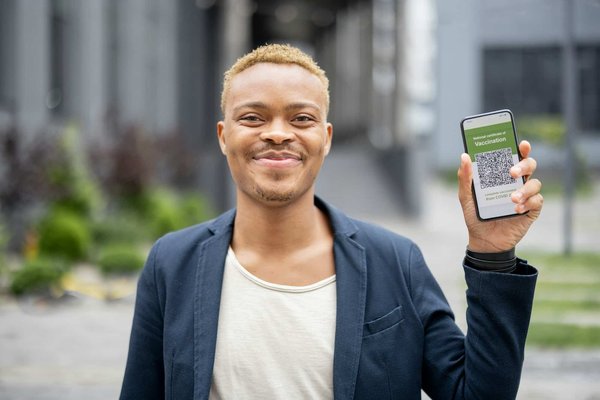 What's the latest guidance on COVID-19 vaccinations for UK international travellers?